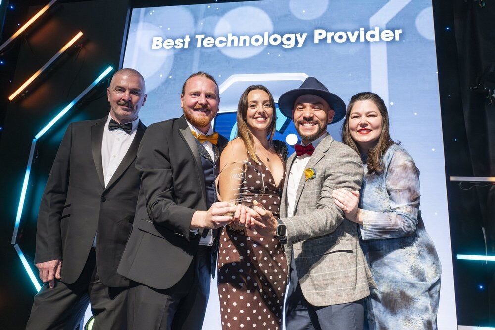 The CrowdComms team collecting a Best Technology Provider award.