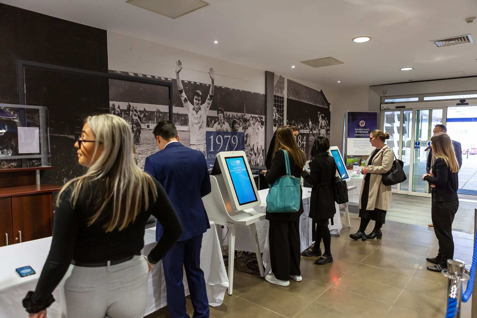 Delegates checking in on Glide kiosks at an Executive Leaders Network event