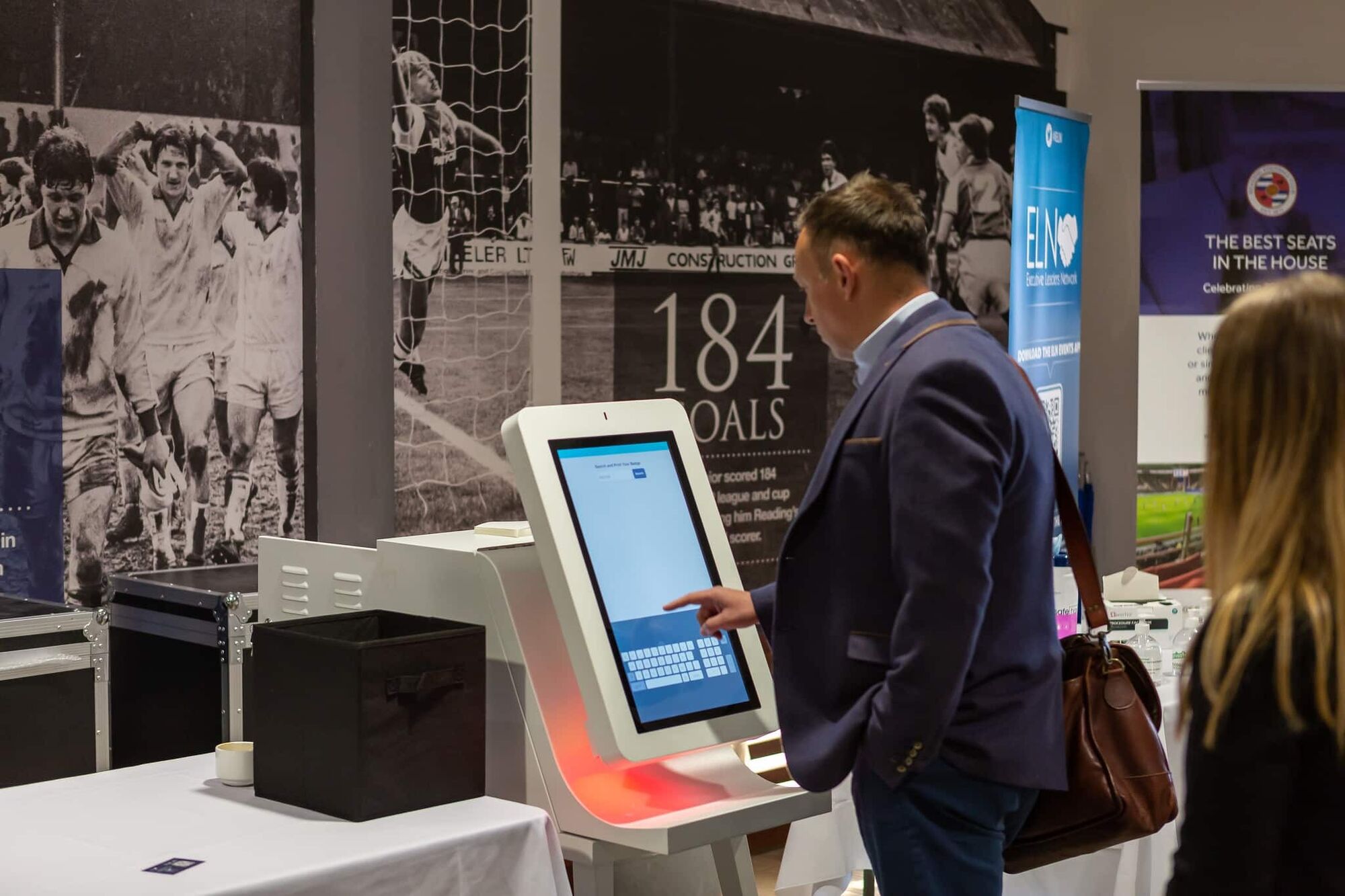 Delegate checking in at a CrowdComms badge-printing kiosk at an ELN event