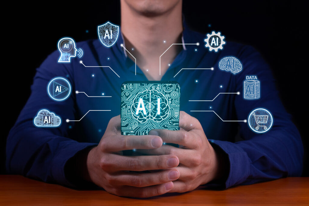 Person in a navy top cupping a glowing circuit-board tile marked AI, linked by lines to icons for cloud, data, brain and shopping AI