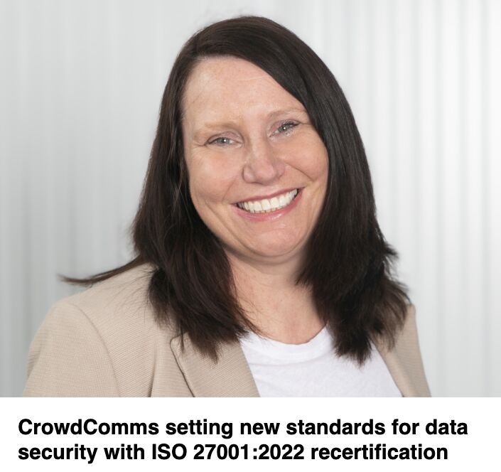 Headshot of a smiling woman in a beige blazer, captioned "CrowdComms setting new standards for data security with ISO 27001:2022 recertification"