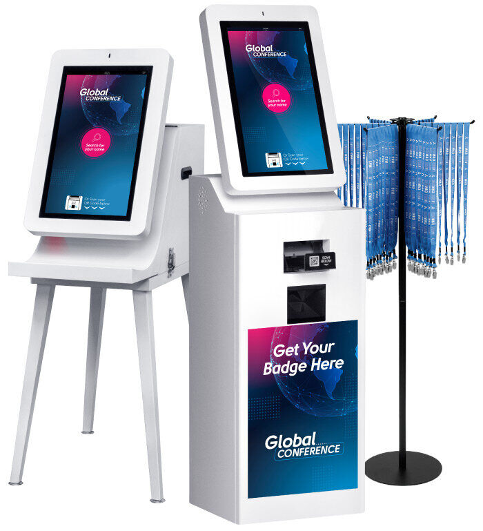 Two self-service badge kiosks branded Global Conference, one on a stand and one floor-standing with a Get Your Badge Here panel, next to a rotating stand of blue lanyards
