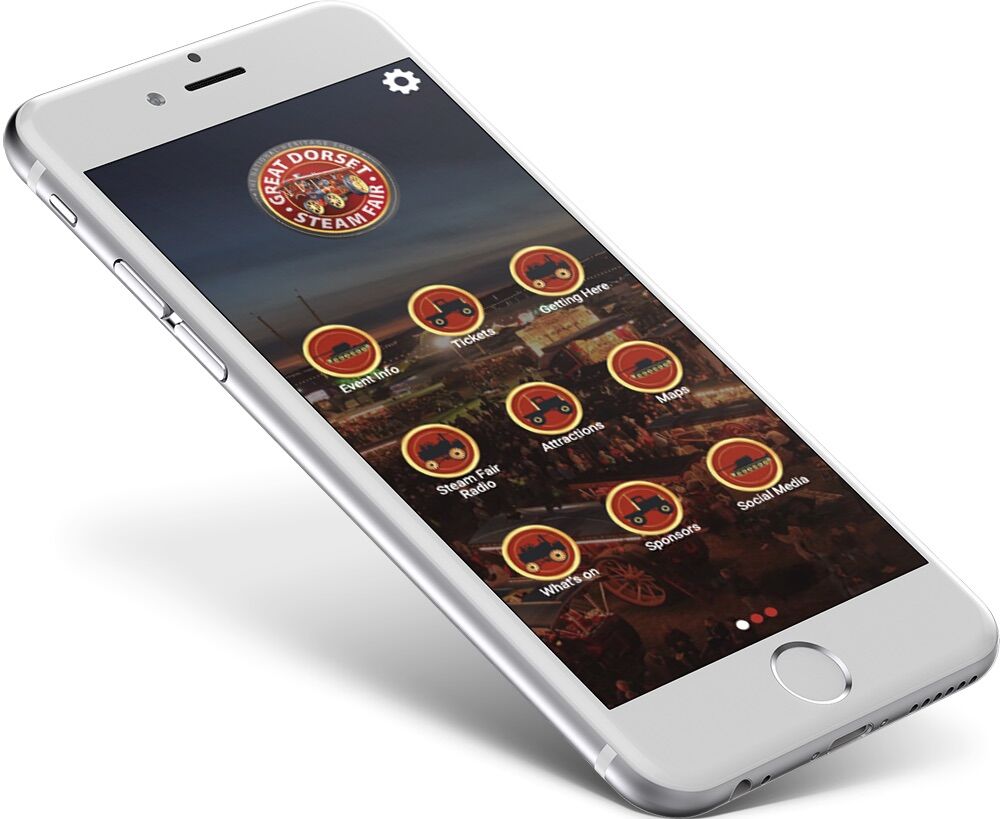 Phone showing a Great Dorset Steam Fair app home screen with circular buttons for tickets, maps, attractions and sponsors