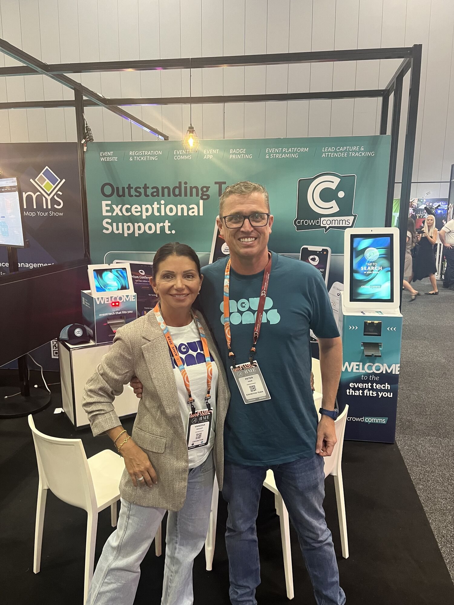 Vanessa Bishop and Peter Hair on the CrowdComms stand at AIME